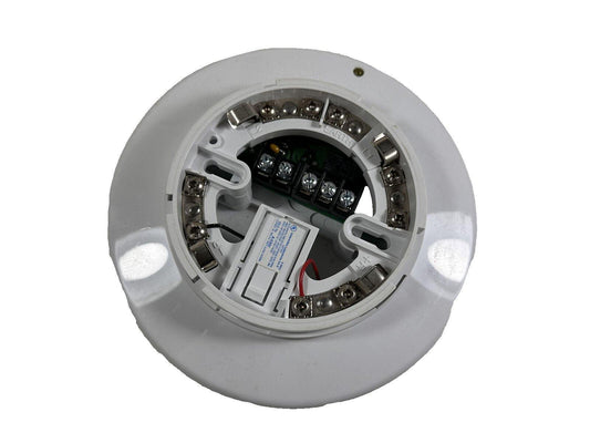 White fire alarm detector with exposed wiring terminals and battery compartment for installation