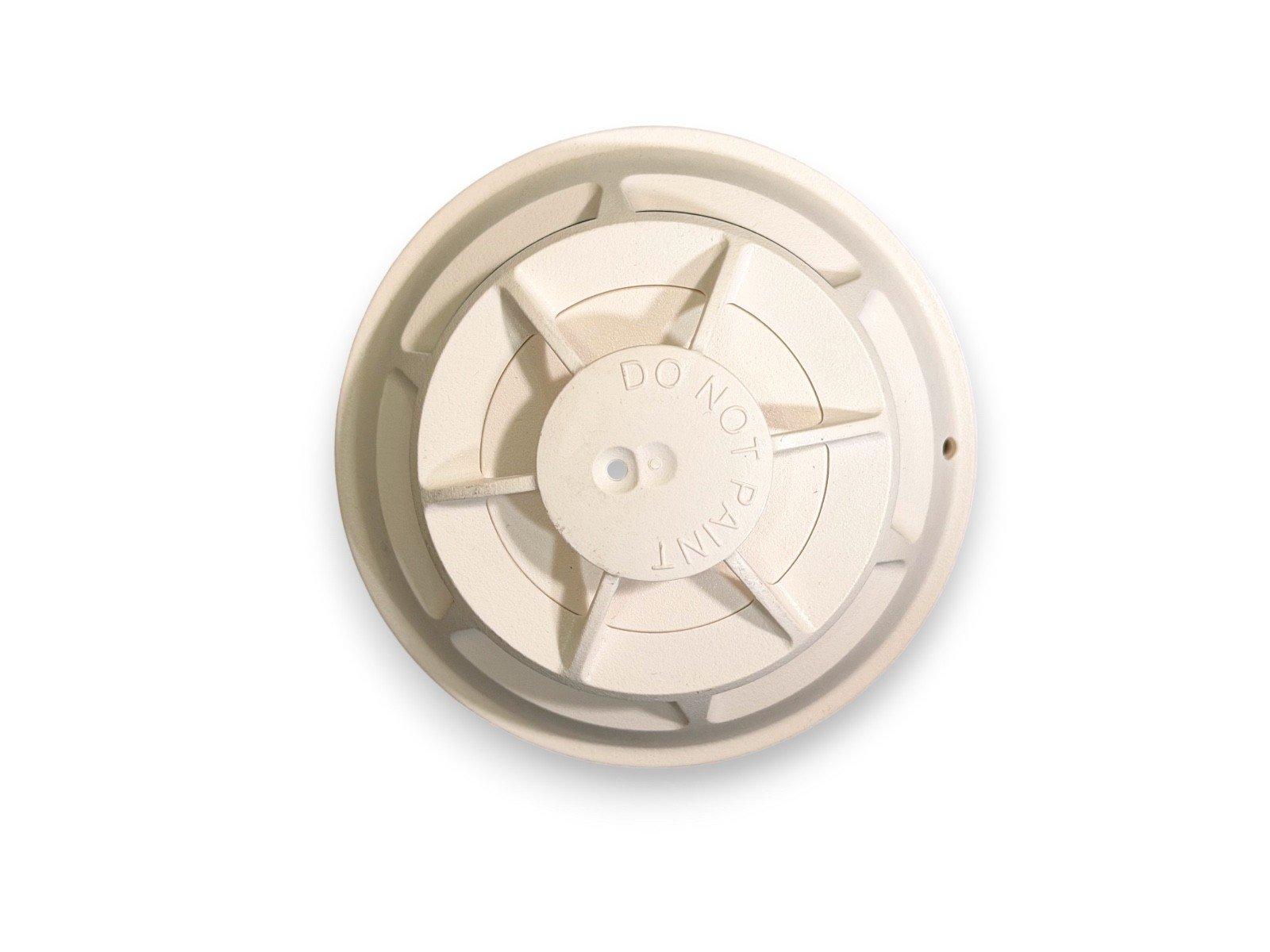 Beige fire alarm smoke detector base with 'DO NOT PAINT' label, for ceiling mounting