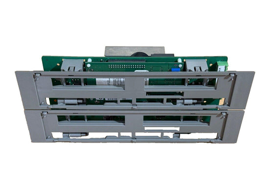 Fire alarm control panel circuit board with gray housing and green PCB components