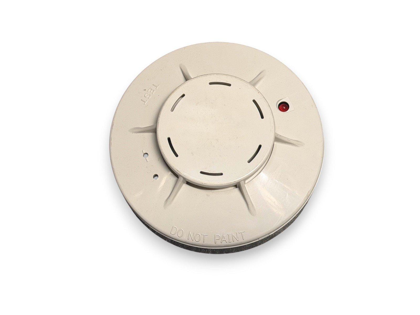 White smoke detector with test button and red LED, labeled 'DO NOT PAINT' for fire alarm systems
