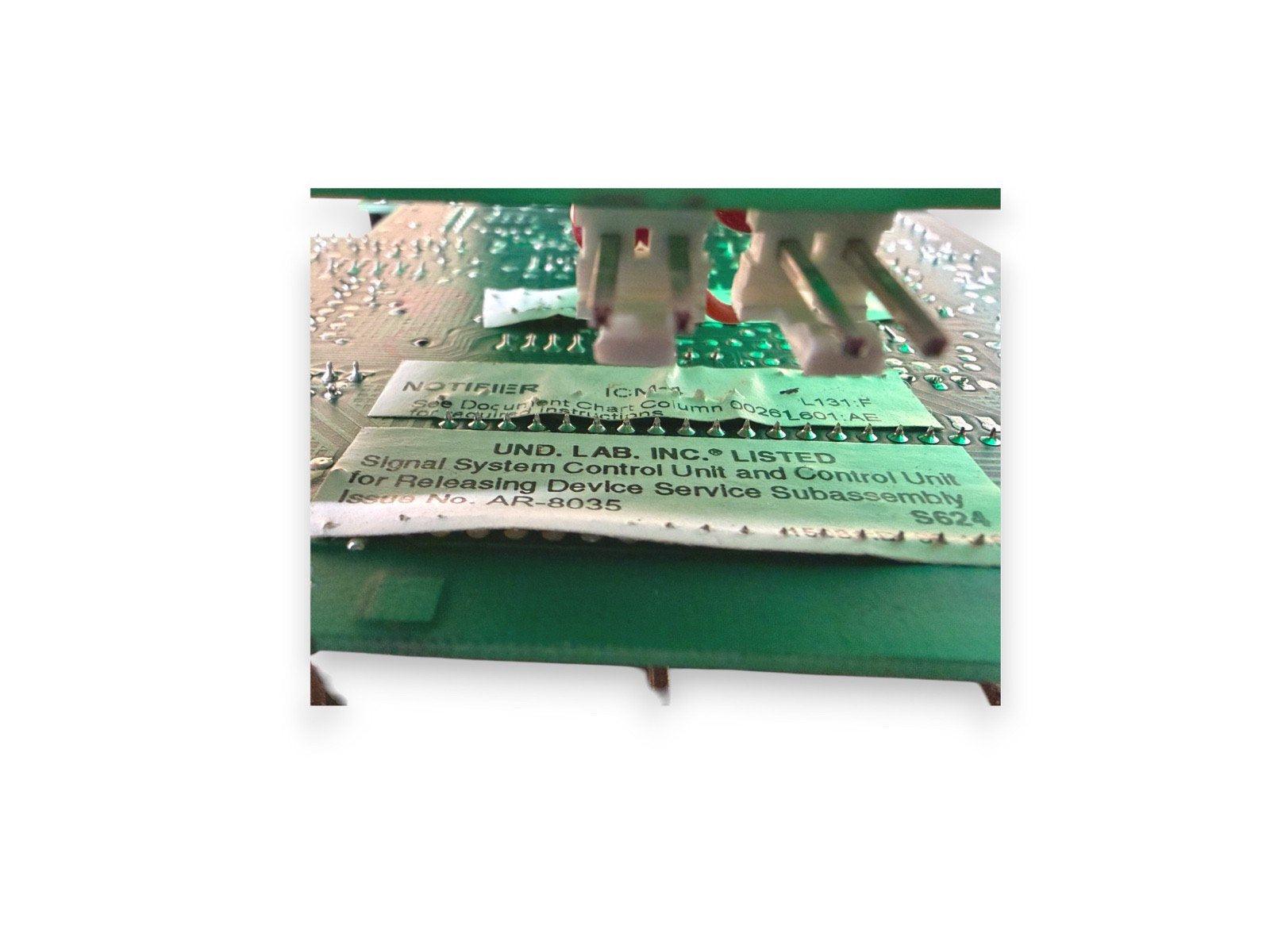 UL Listed fire alarm control unit circuit board with connectors and labels