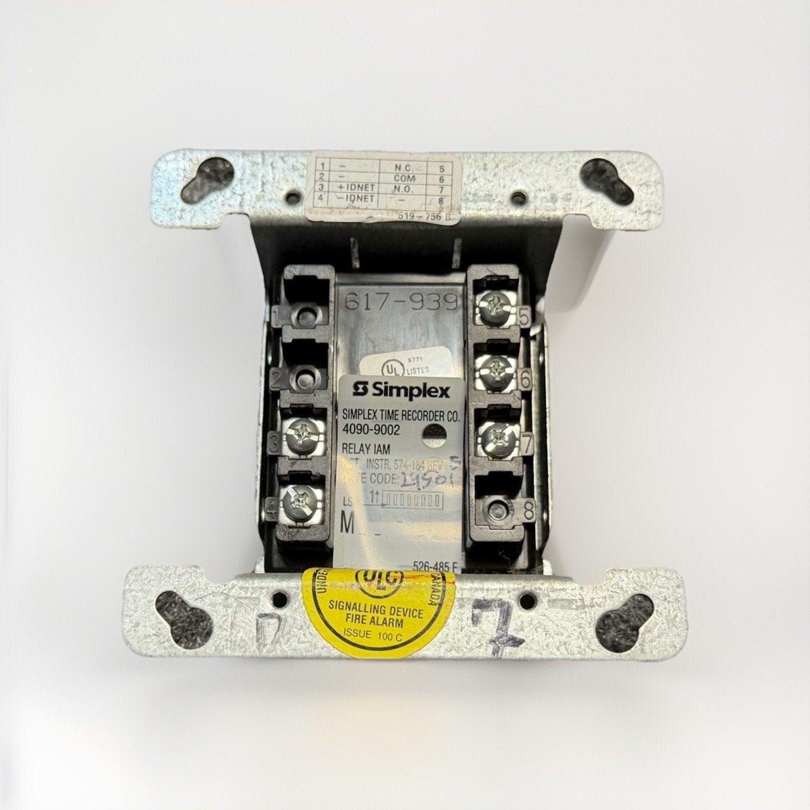 Simplex 617-939 fire alarm relay module with UL listed signalling device label, used in commercial fire safety systems