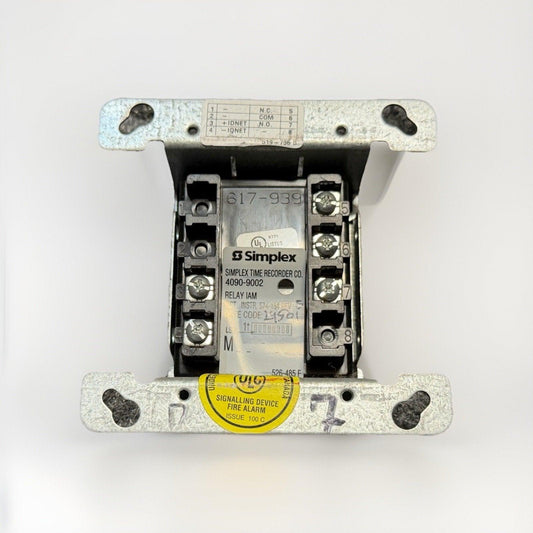 Simplex 617-939 fire alarm relay module with UL listed signalling device label, used in commercial fire safety systems