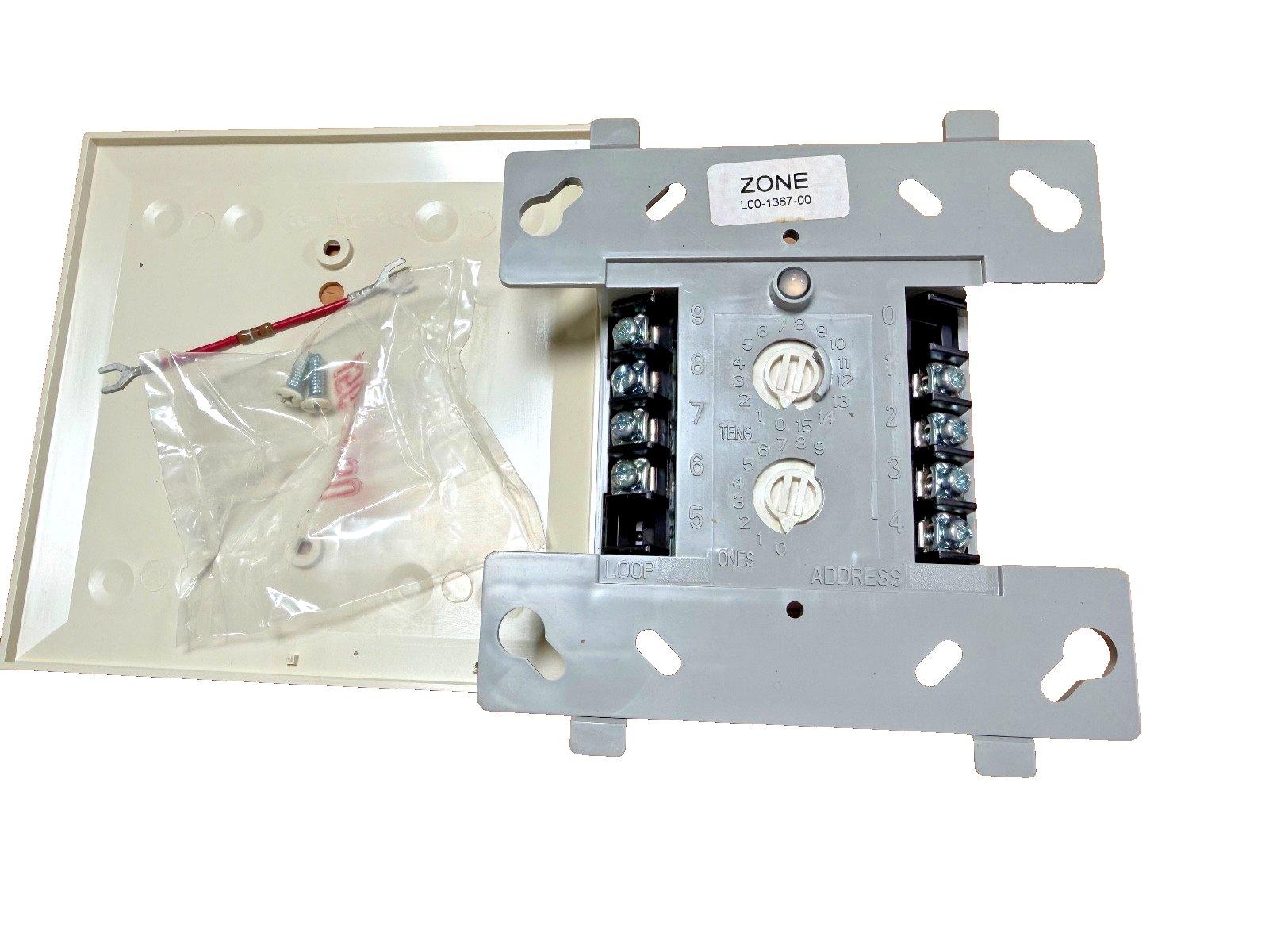 Fire alarm zone module with addressable DIP switches, terminal blocks, and mounting hardware for fire safety systems