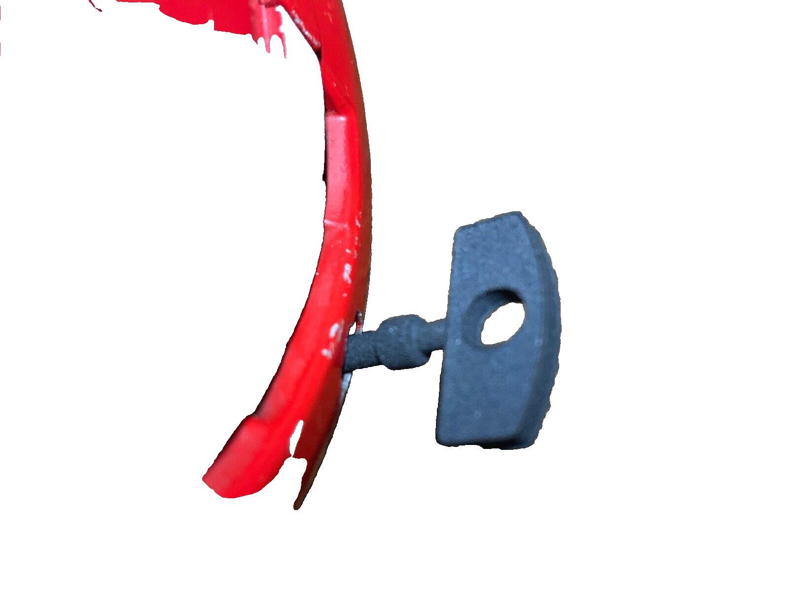 Red fire alarm bell with black mounting bracket, used fire safety equipment