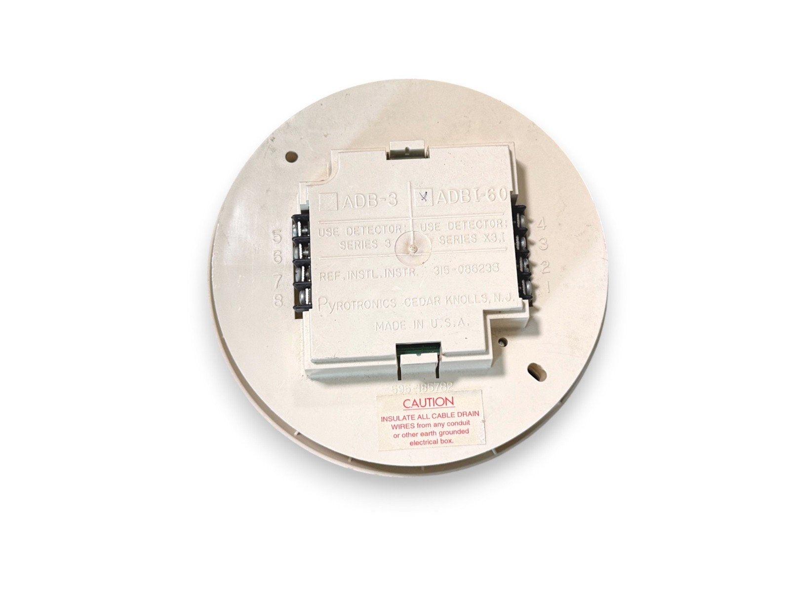 Pyrotronics ADBI-60 fire alarm detector base, Series X3.1, made in USA with wiring terminals and caution label