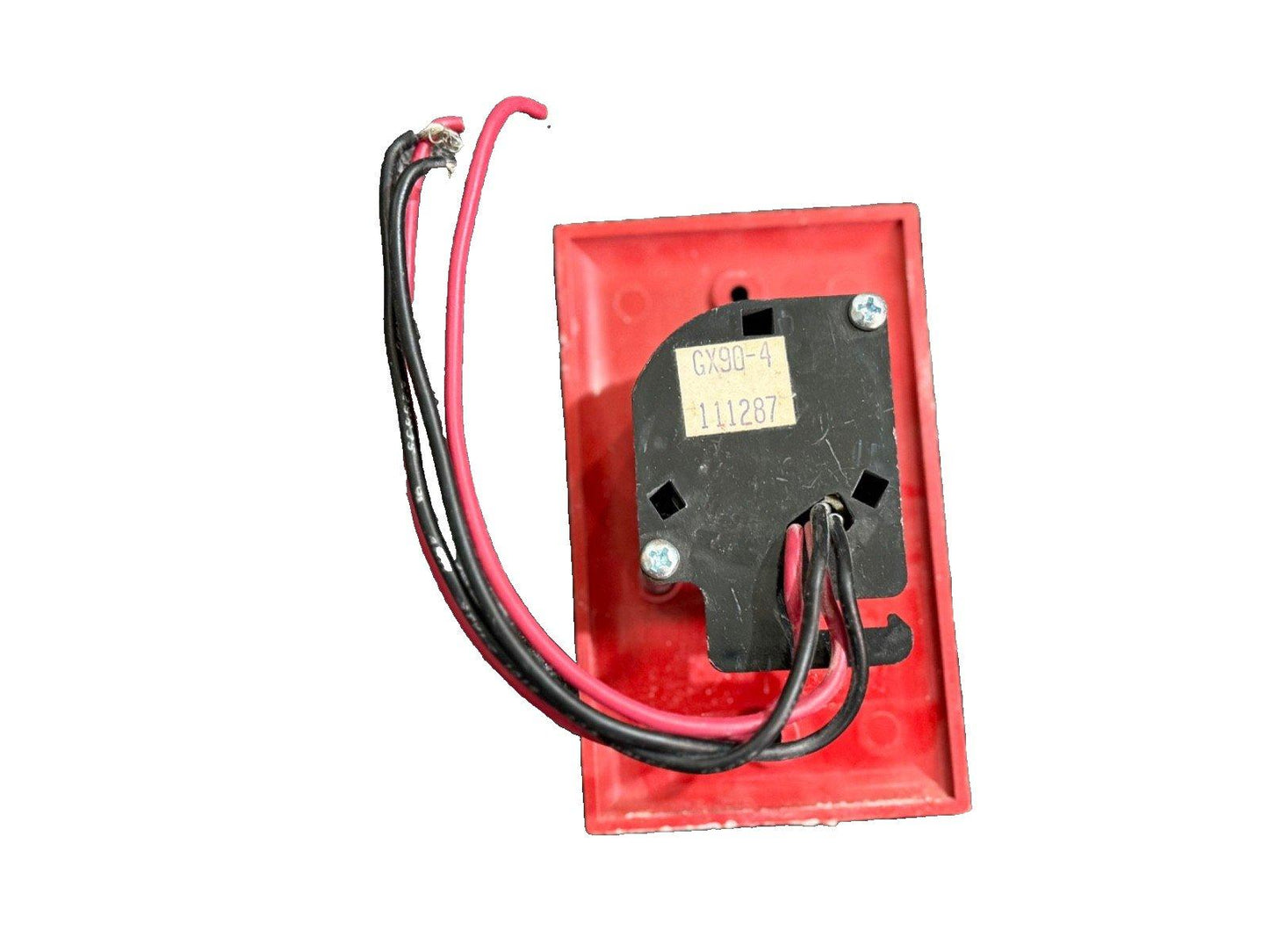 Red fire alarm pull station with GX90-4 label and black/red wiring for commercial safety systems