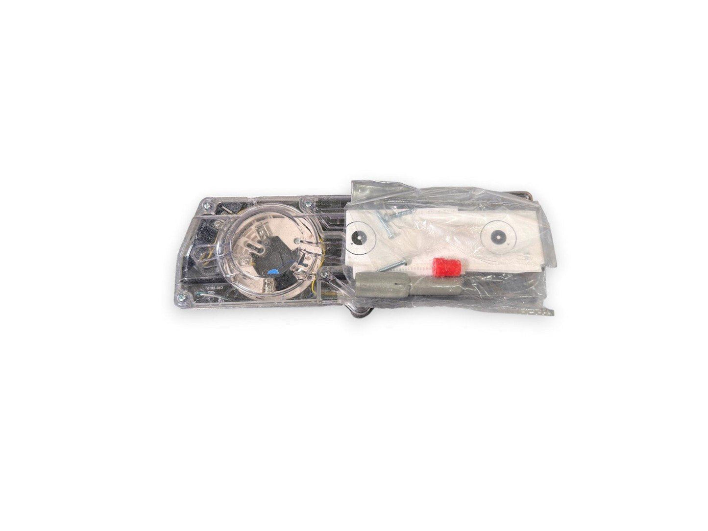 Fire alarm strobe light with clear housing and red test button, packaged for installation