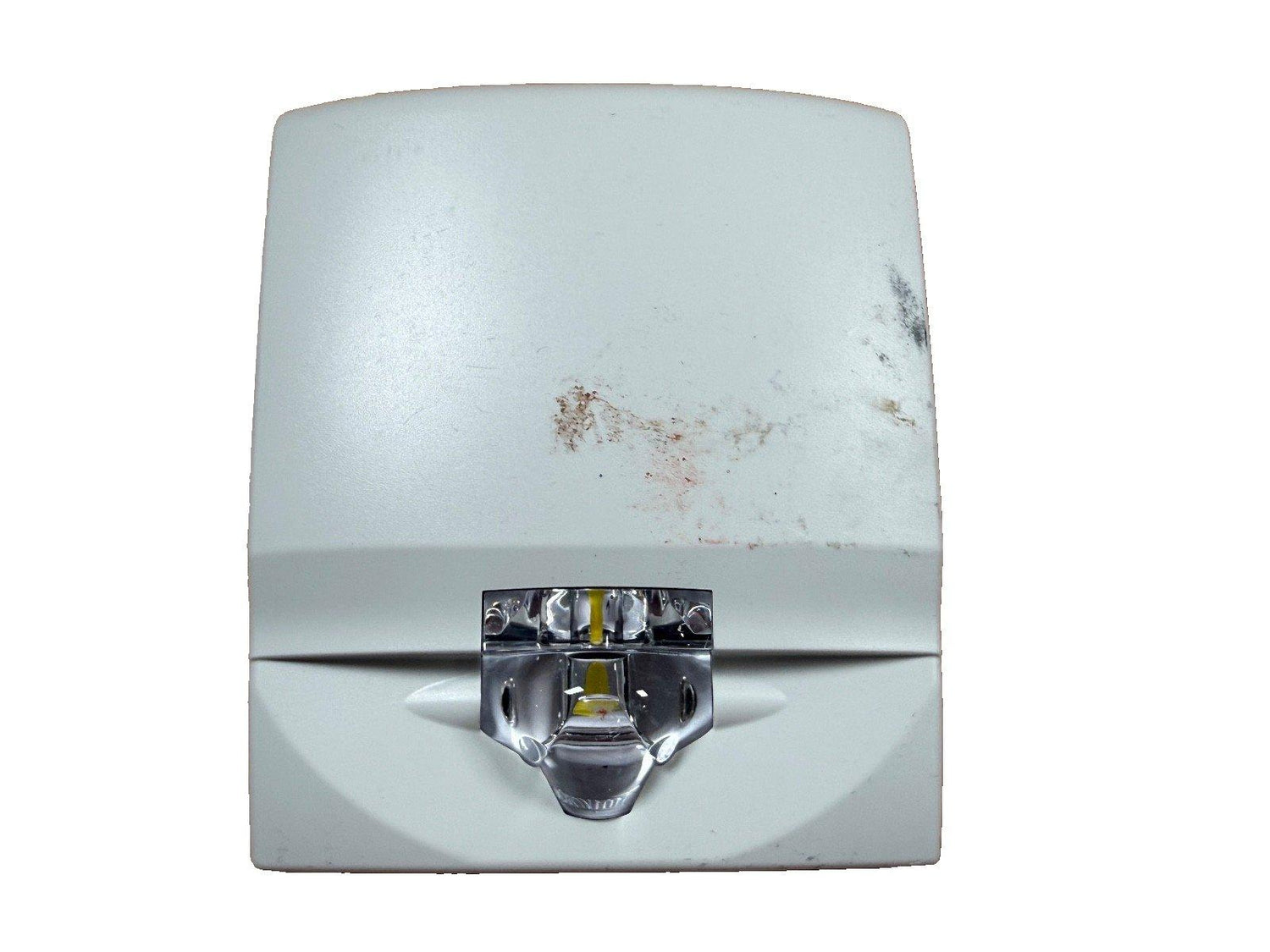 Used fire alarm strobe light with visible wear, white housing and chrome lens for safety systems