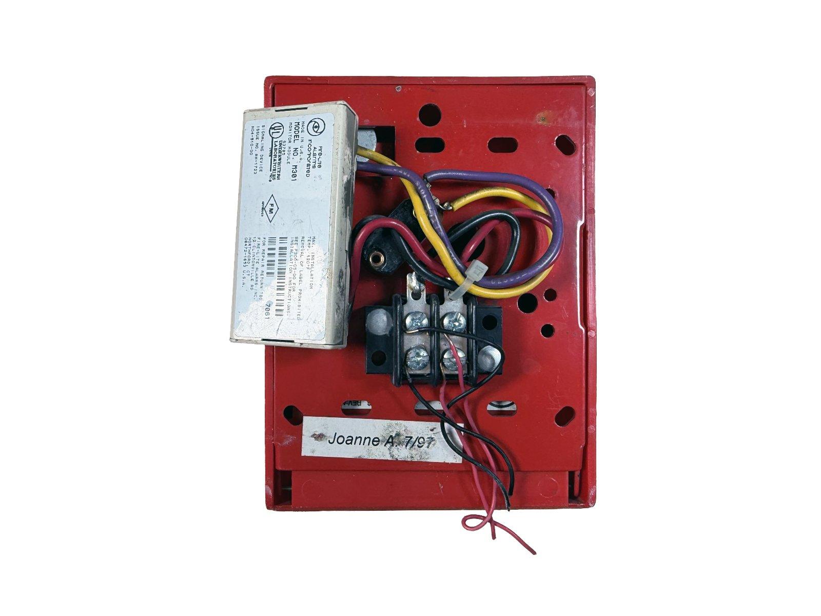 Used fire alarm control module with wiring, red housing, and UL label for commercial safety systems