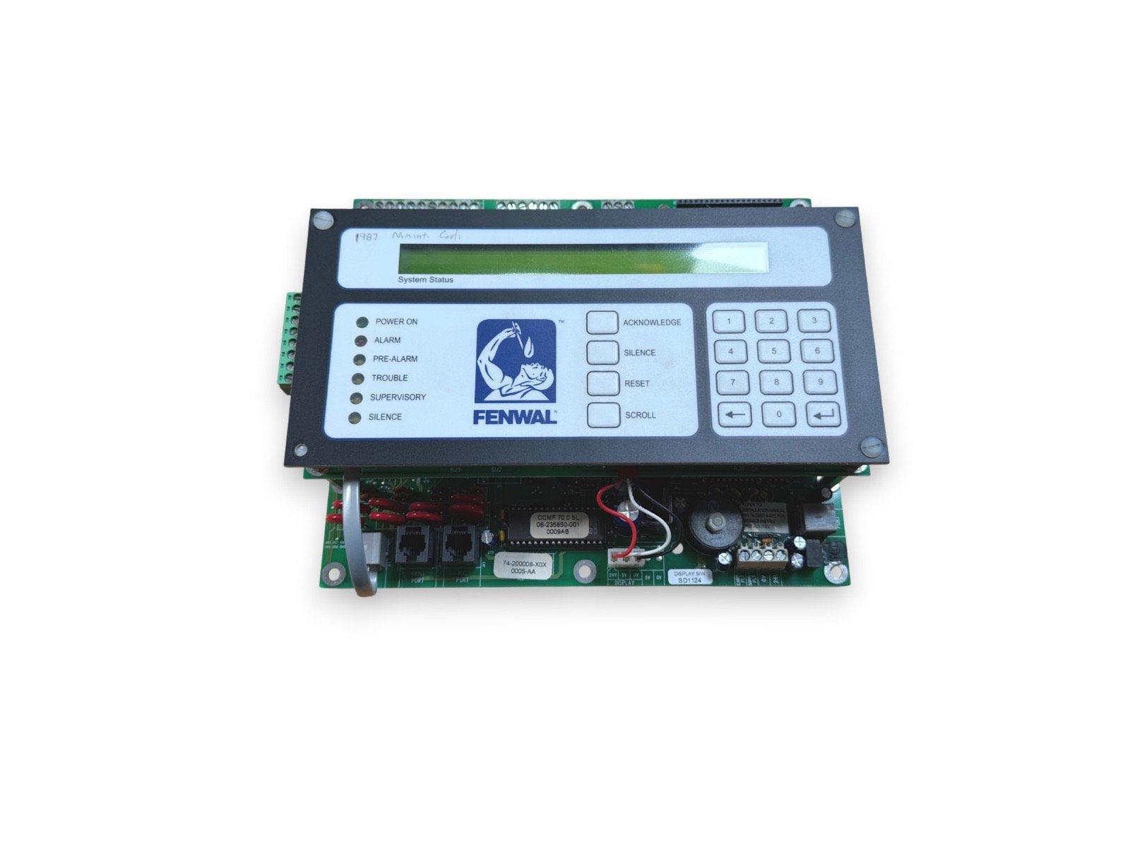 FENWAL fire alarm control panel with LCD display, keypad, and status indicators for power, alarm, trouble, and silence