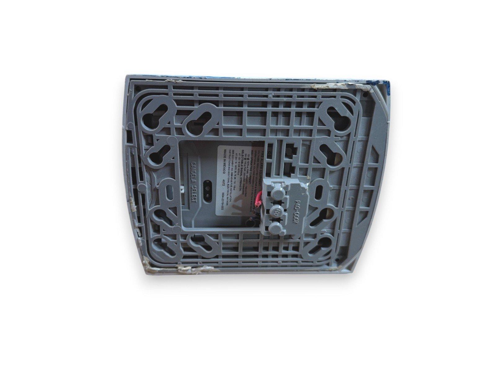 Gentex fire alarm control panel back view with wiring terminals and label details