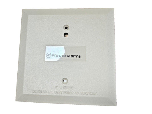 Fire-Lite Alarms fire alarm control panel with caution label and mounting holes