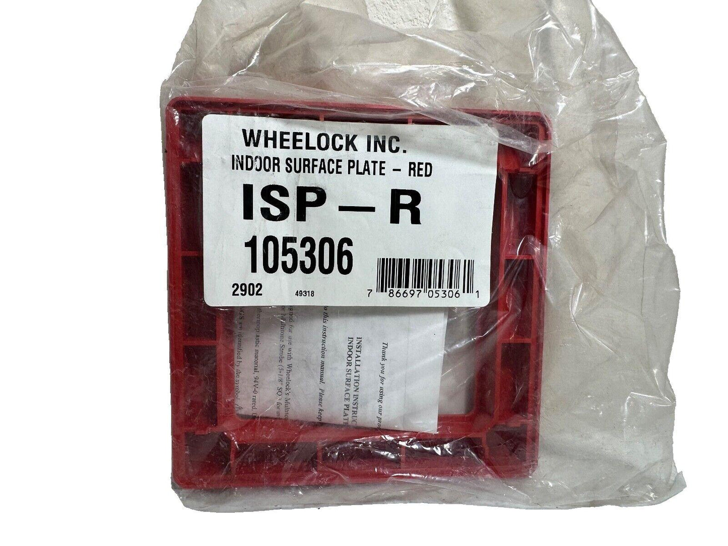 Red Wheelock indoor surface plate ISP-R 105306 for fire alarm systems, sealed in plastic