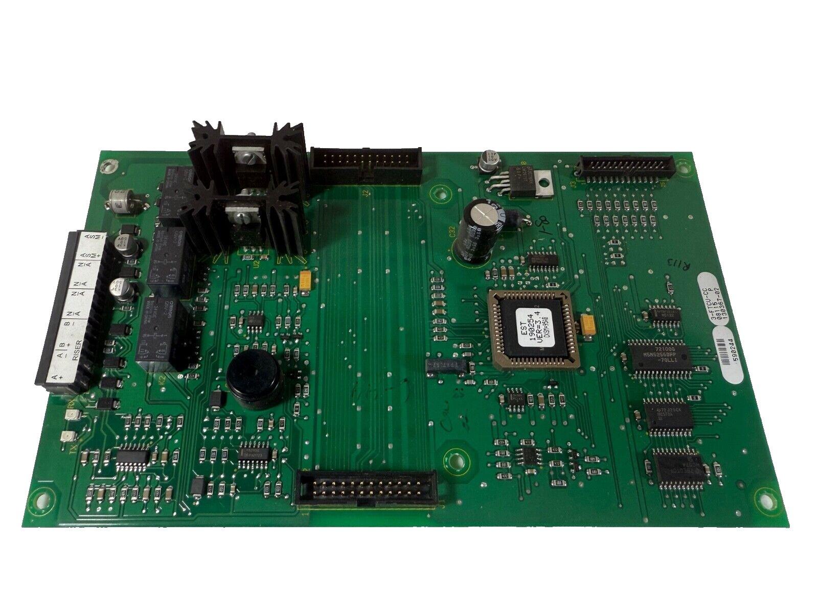 Green fire alarm control panel circuit board with EST chip and connectors for fire safety systems