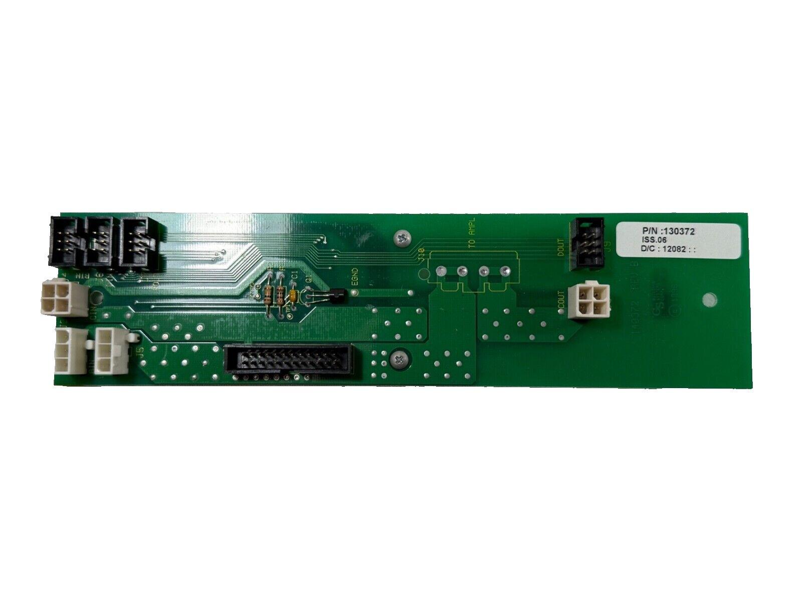 Green fire alarm control panel circuit board with connectors and part number 130372