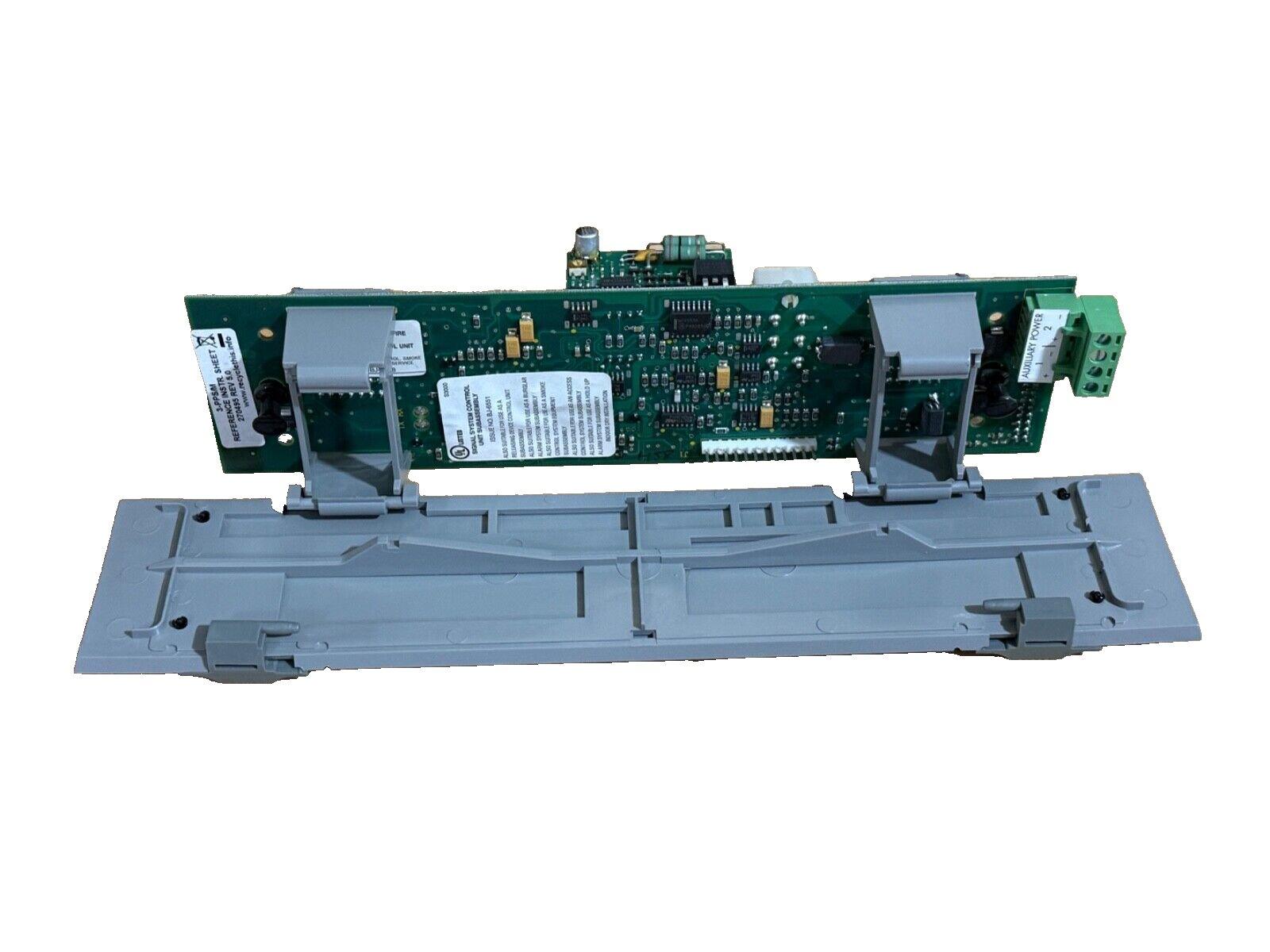 Fire alarm control panel circuit board with auxiliary power terminals and mounting bracket