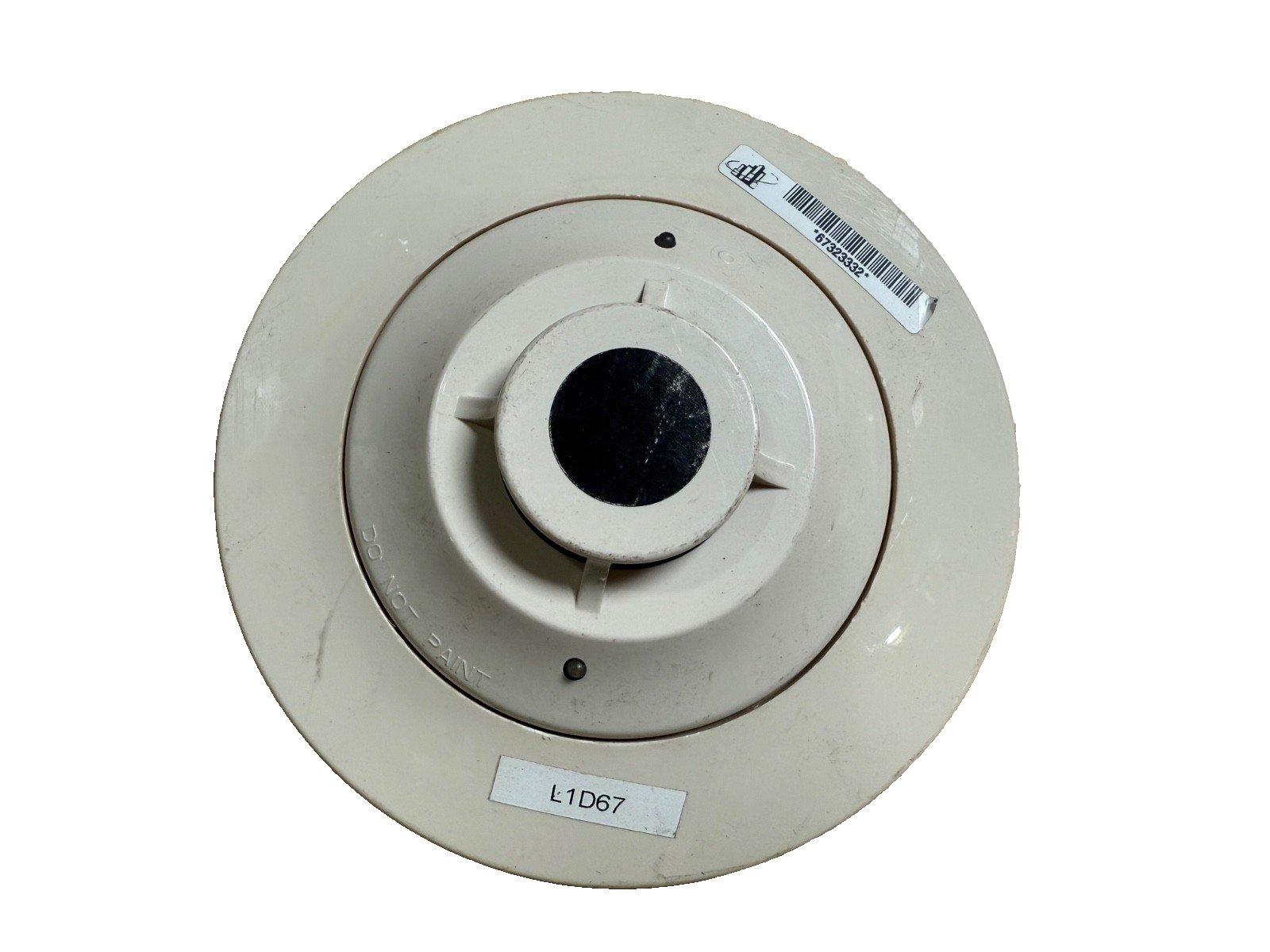 White fire alarm smoke detector with model L1D67, barcode label, and 'DO NOT PAINT' warning
