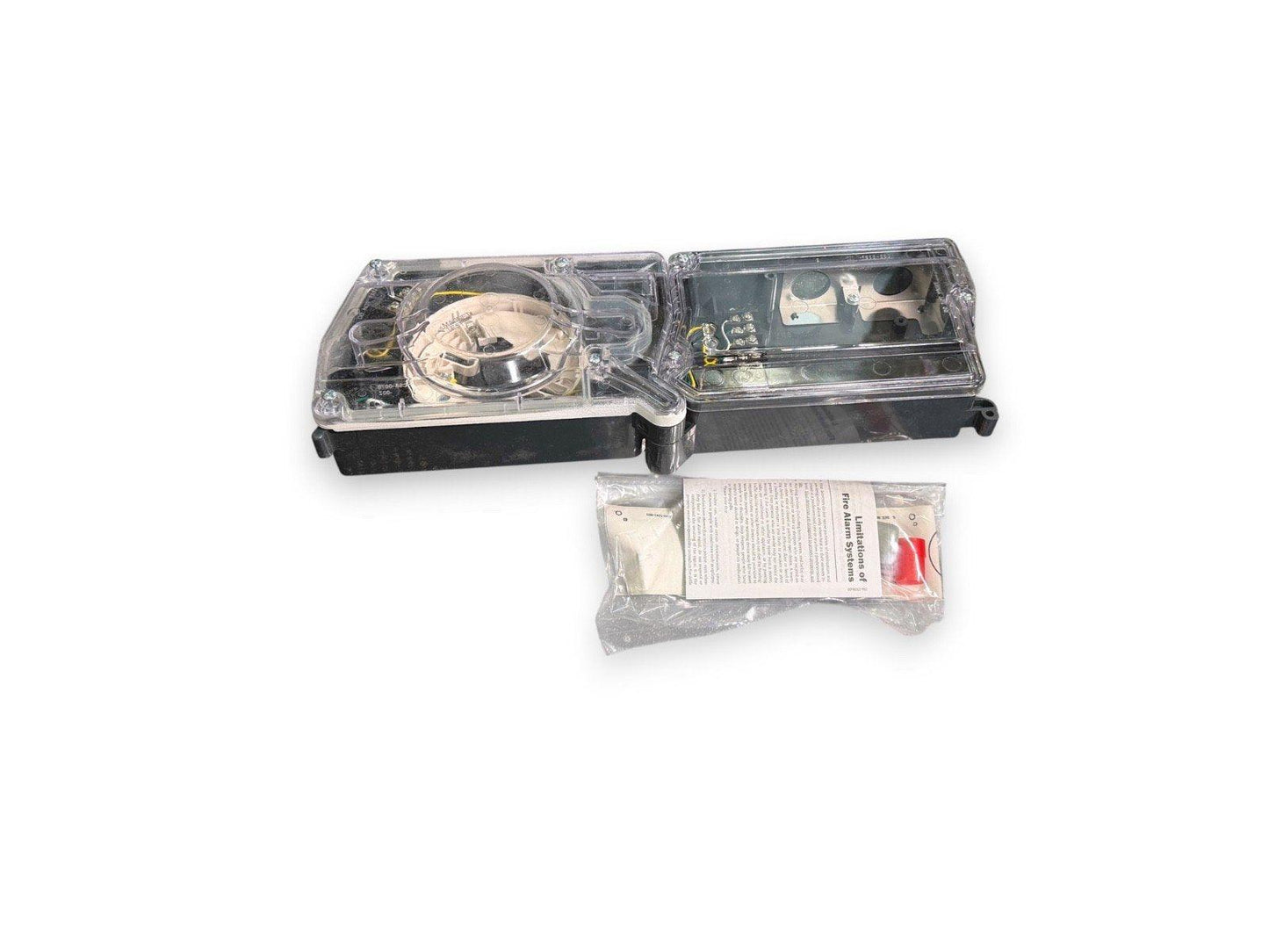 Fire alarm strobe light with clear cover, internal wiring, and instruction packet for safety systems
