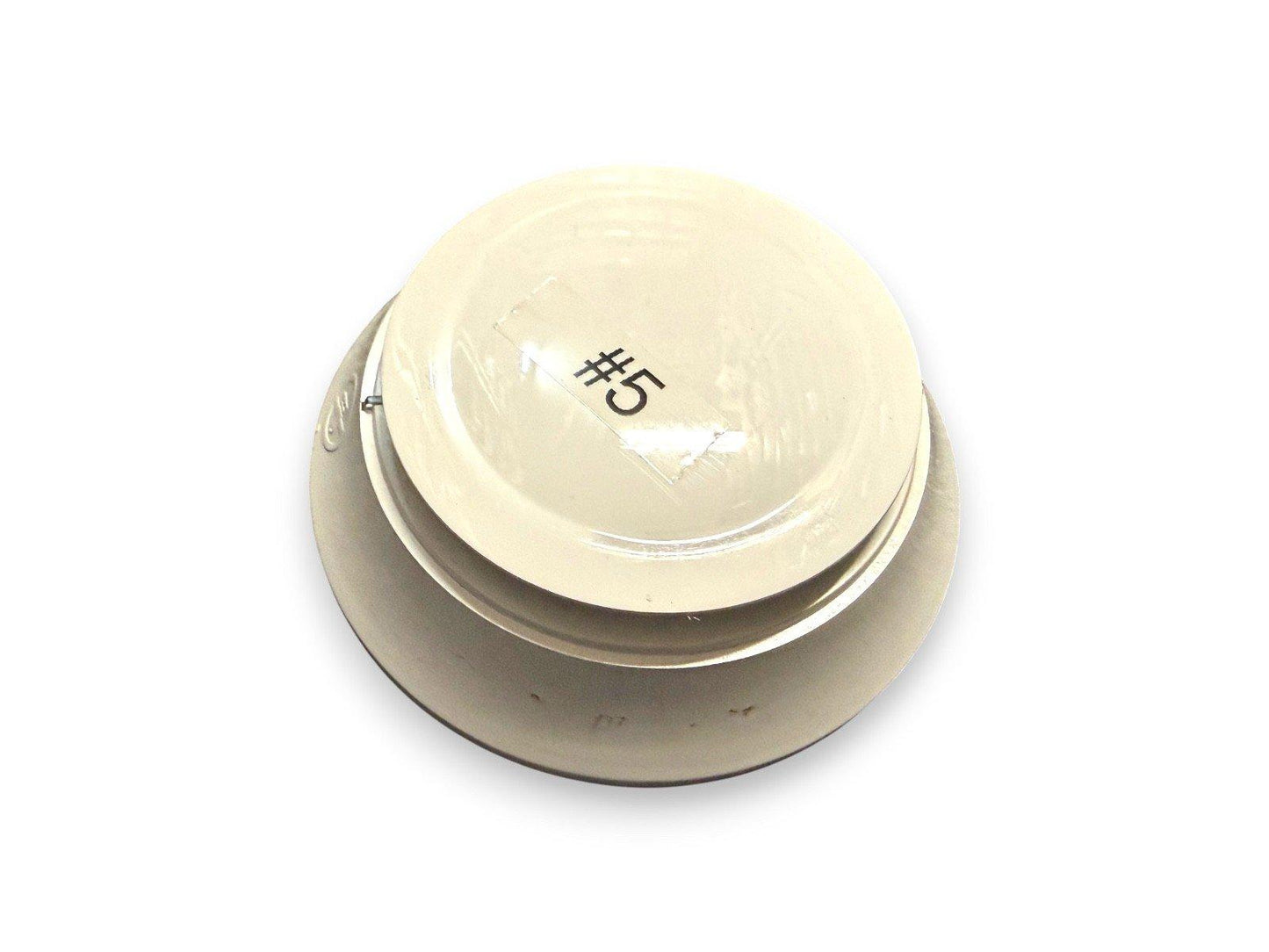 Beige fire alarm detector with #5 label, used fire safety equipment