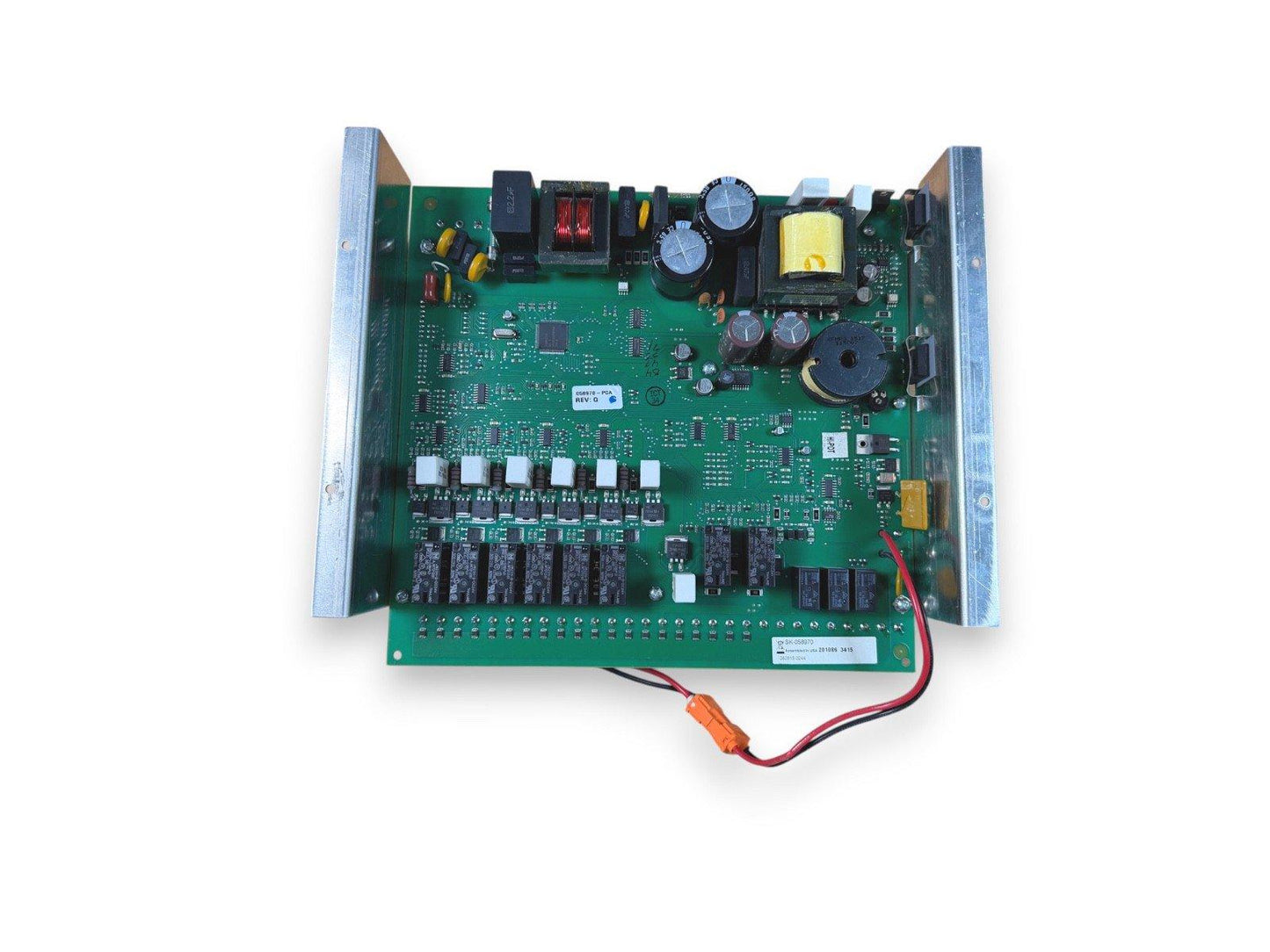 Fire alarm control panel circuit board with relays, capacitors, and wiring terminals for fire safety systems
