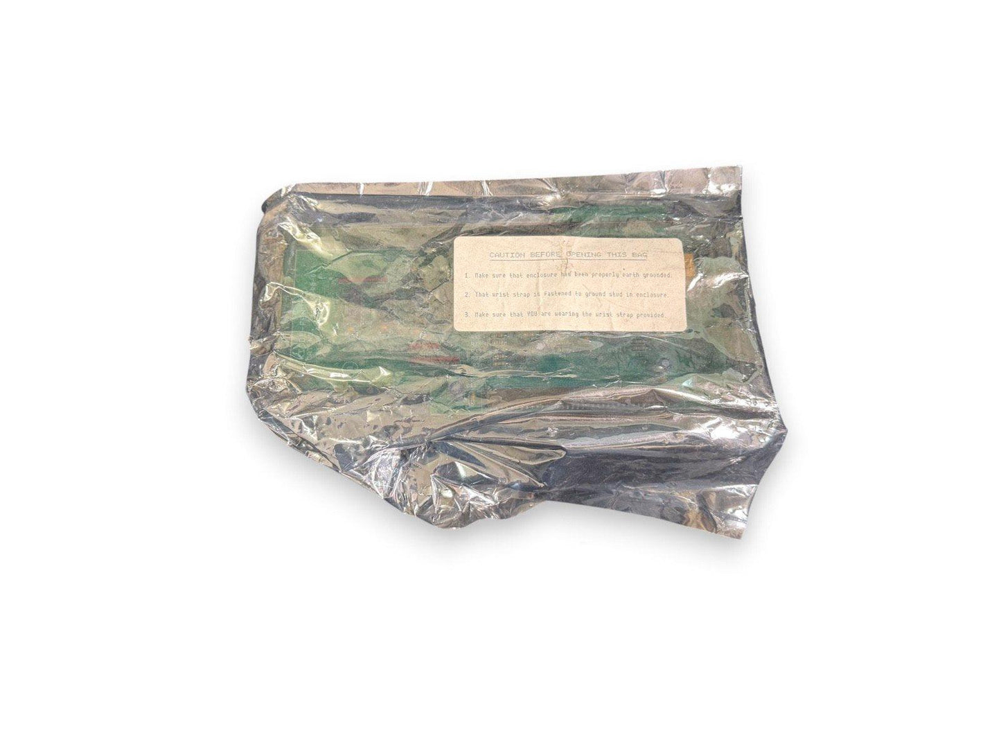 Static-sensitive fire alarm component in anti-static bag with grounding caution label