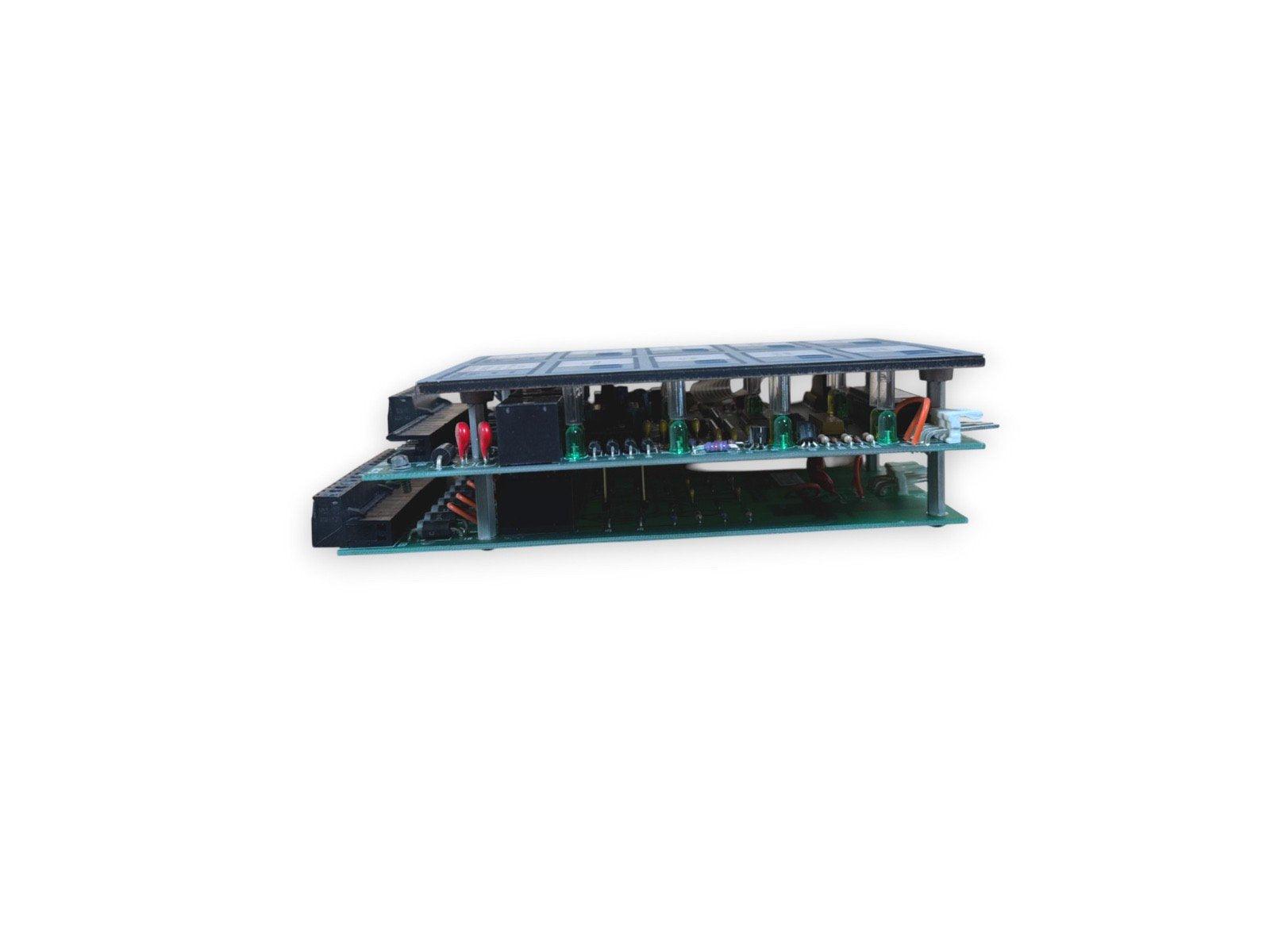 Fire alarm control panel circuit board with green LEDs and connectors for fire safety systems