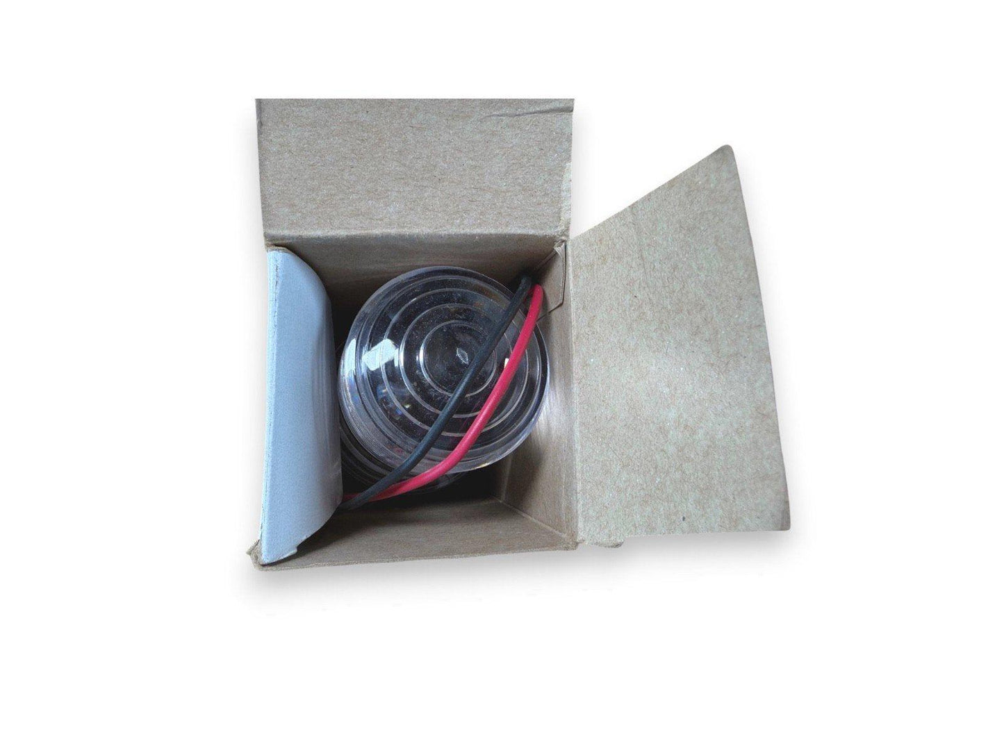 Fire alarm strobe light with red and black wires in open box