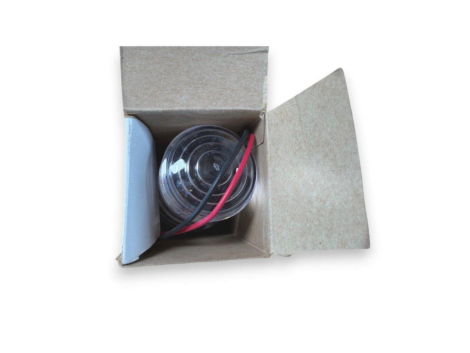 Fire alarm strobe light with red and black wires in open box