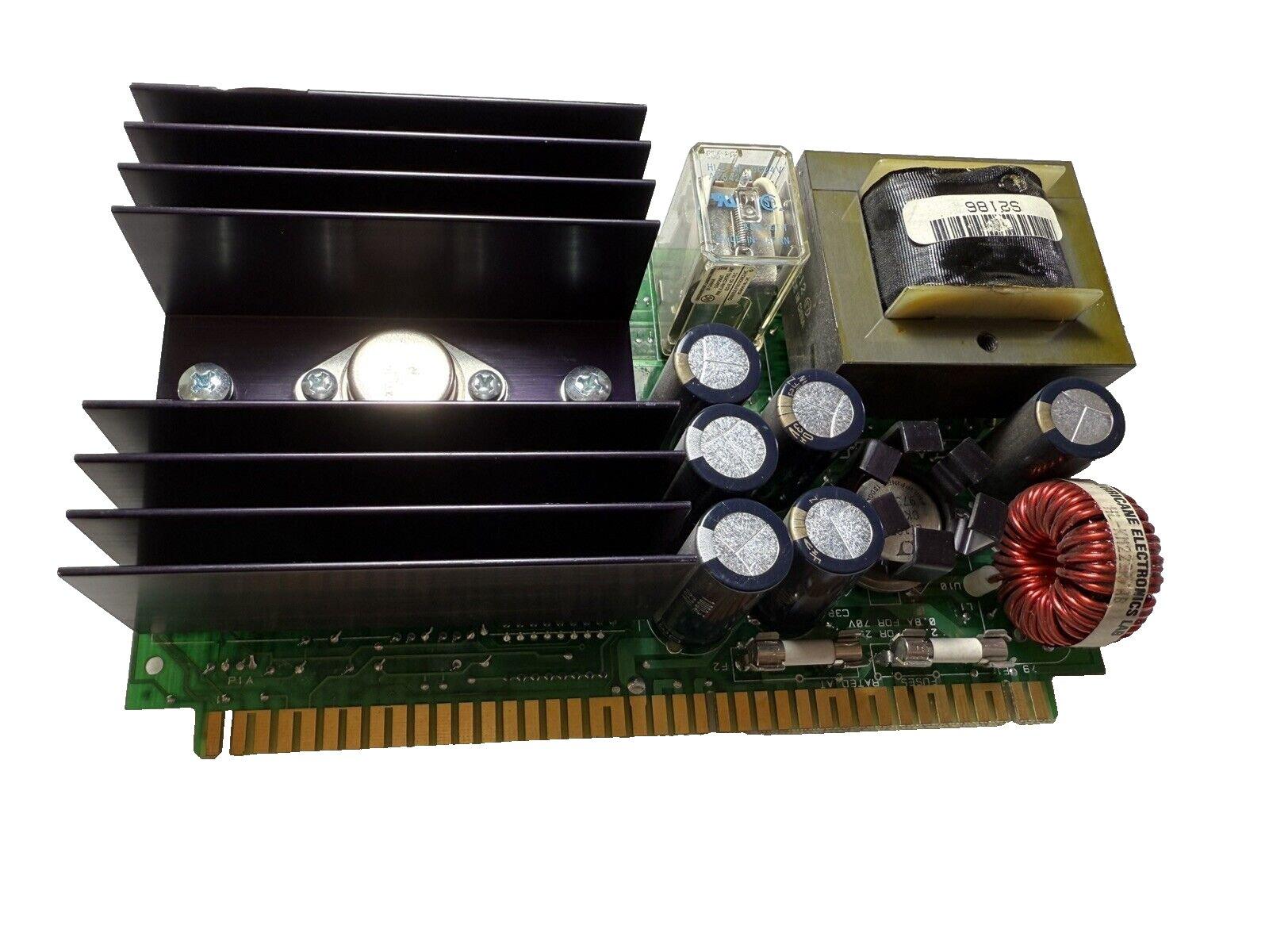 Fire alarm control panel circuit board with heatsink, capacitors, and transformer for fire safety systems