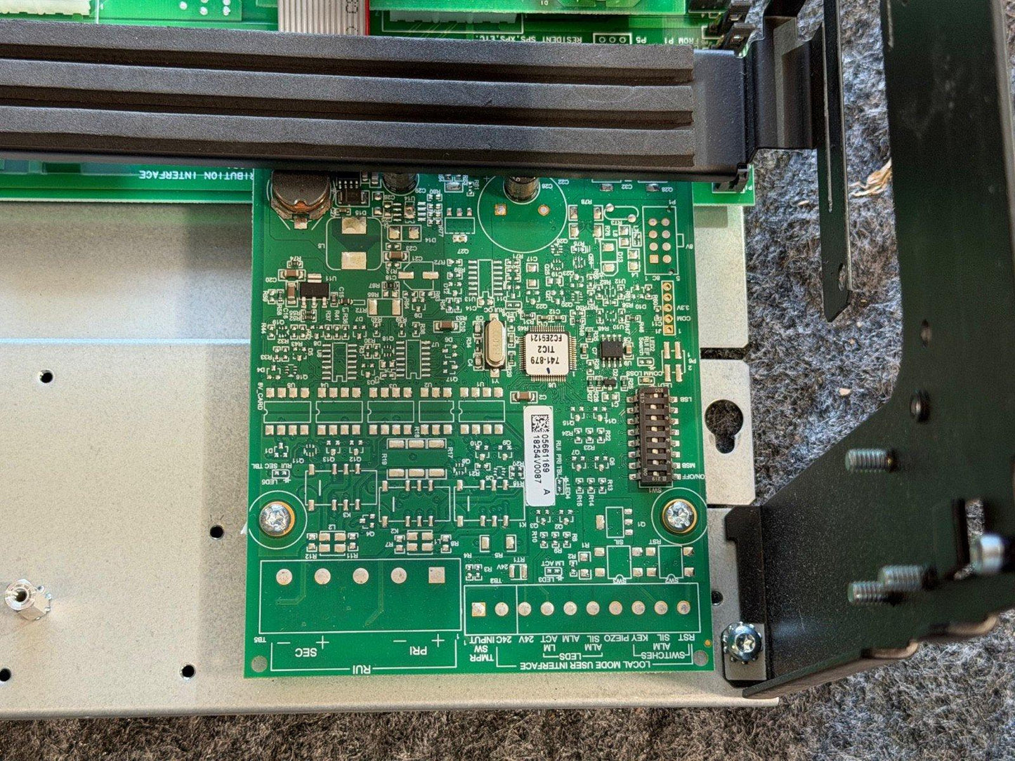 Fire alarm control panel circuit board with green PCB and interface connectors