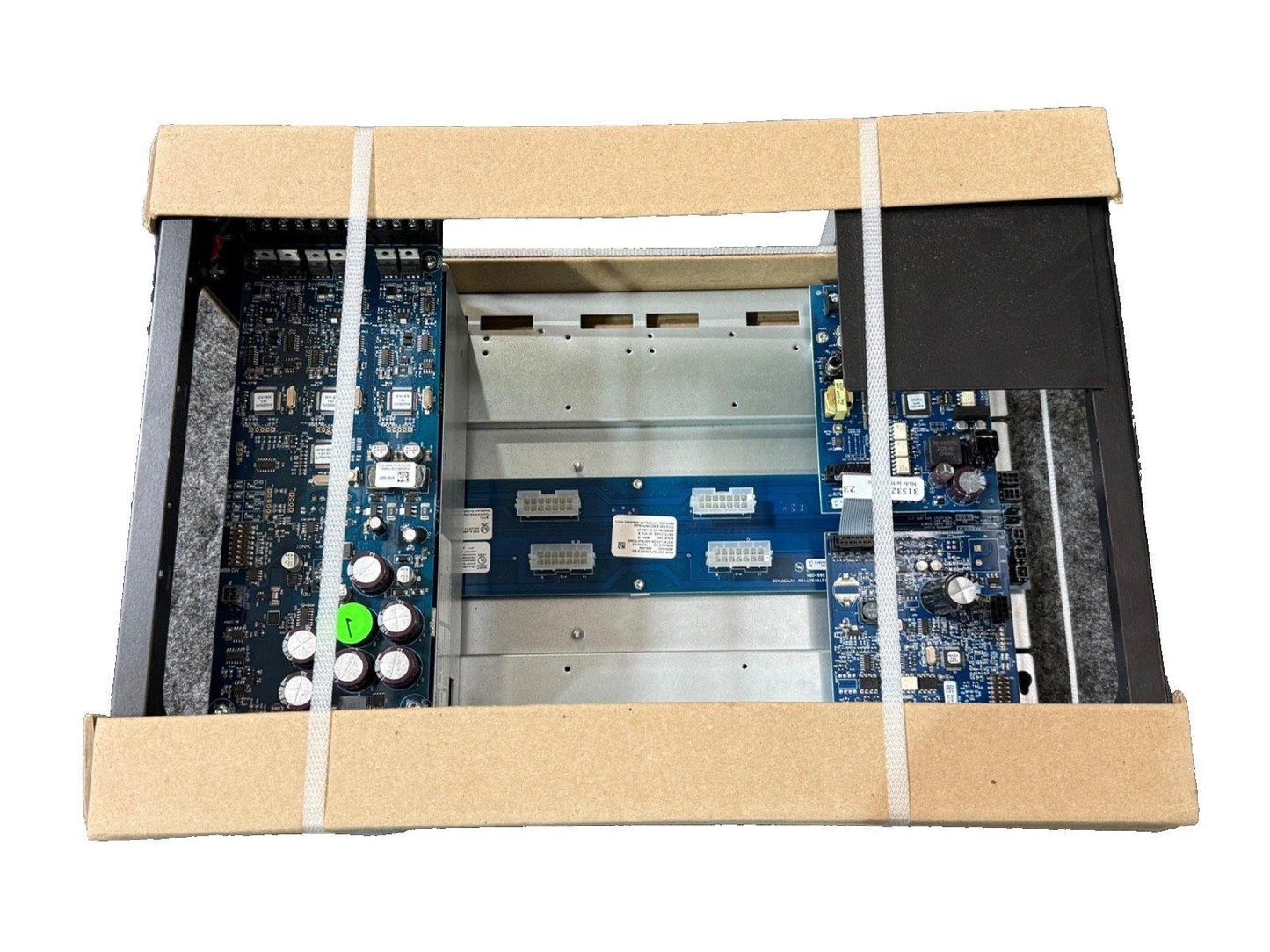 Fire alarm control panel with circuit boards, secured in shipping box for safe delivery