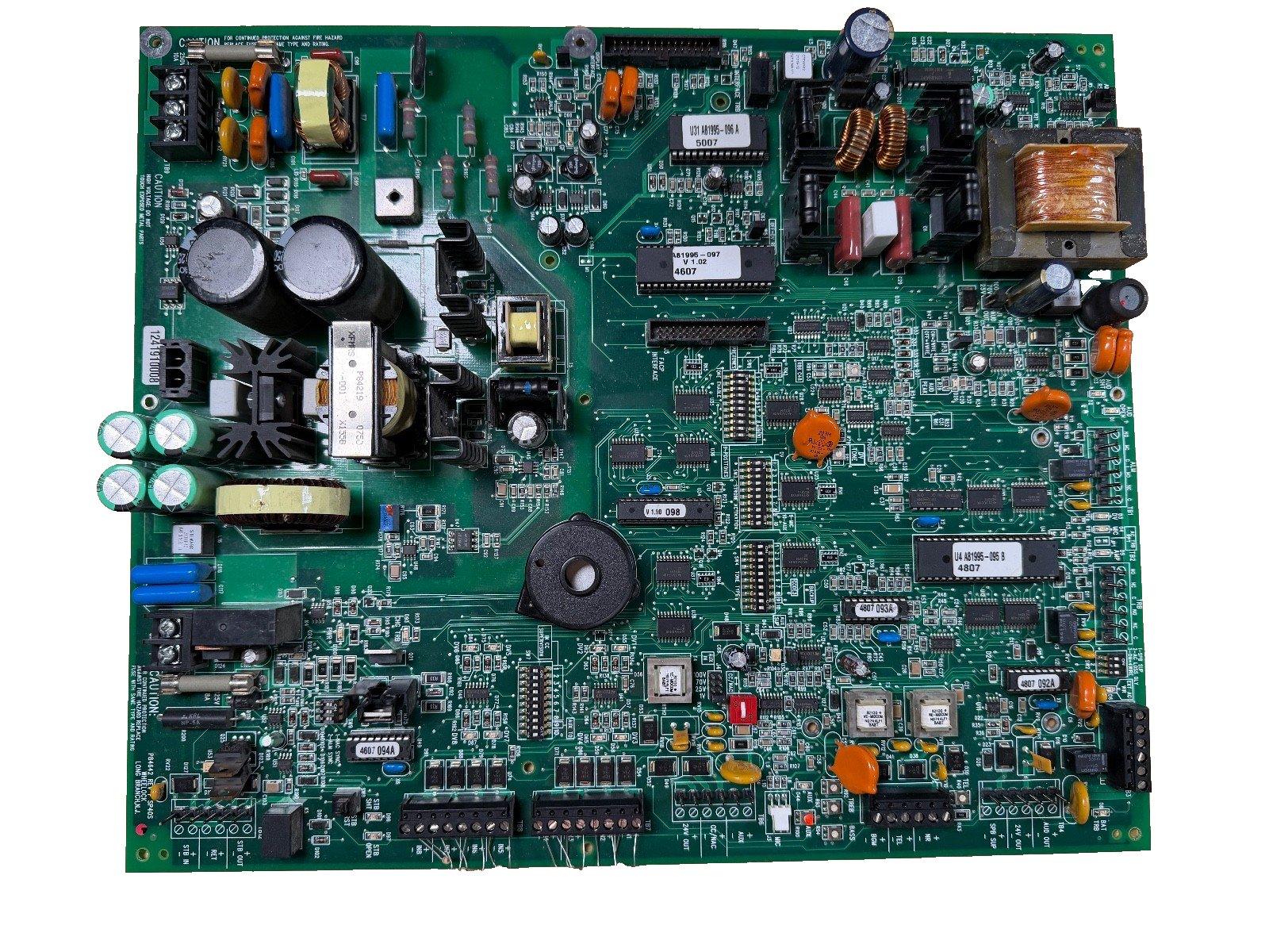 Fire alarm control panel circuit board with capacitors, resistors, and ICs for fire safety systems