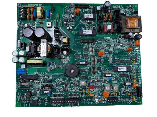 Fire alarm control panel circuit board with capacitors, resistors, and ICs for fire safety systems
