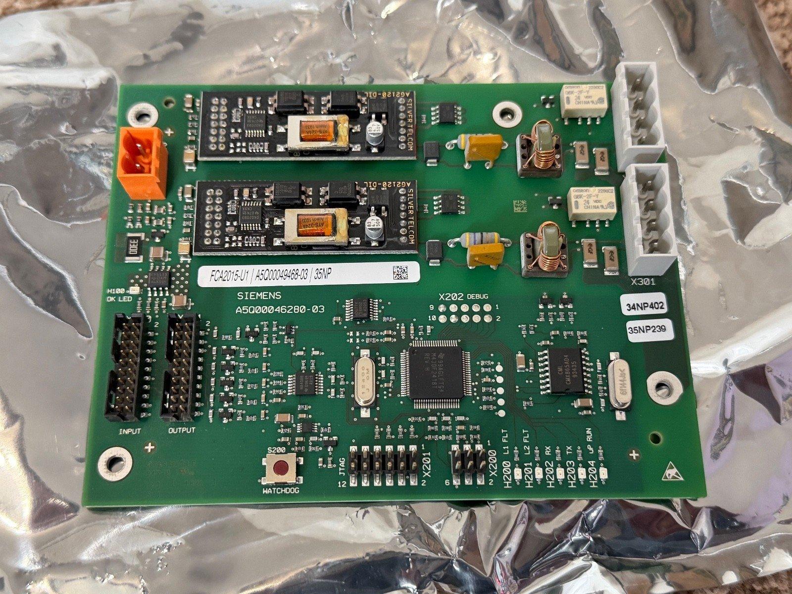 Siemens fire alarm control panel circuit board with connectors and components for fire safety systems