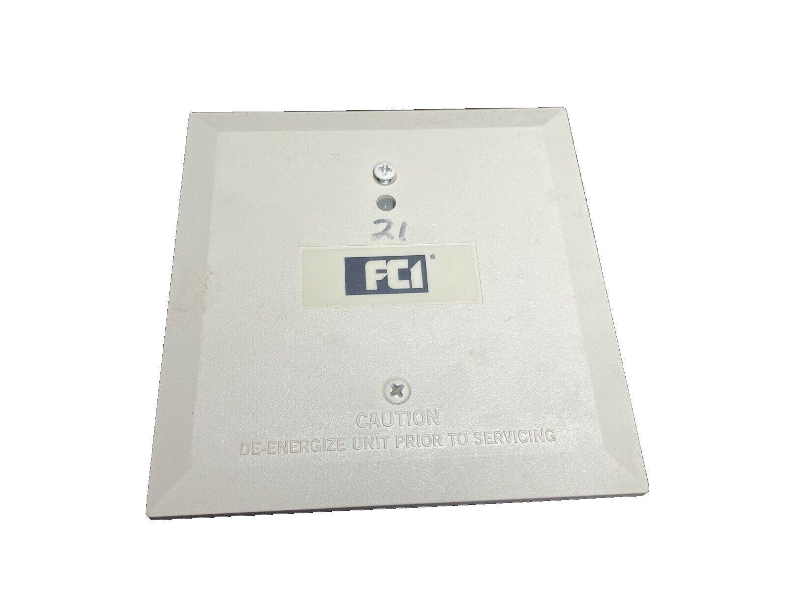 FCI fire alarm control panel cover with caution label, used fire safety equipment