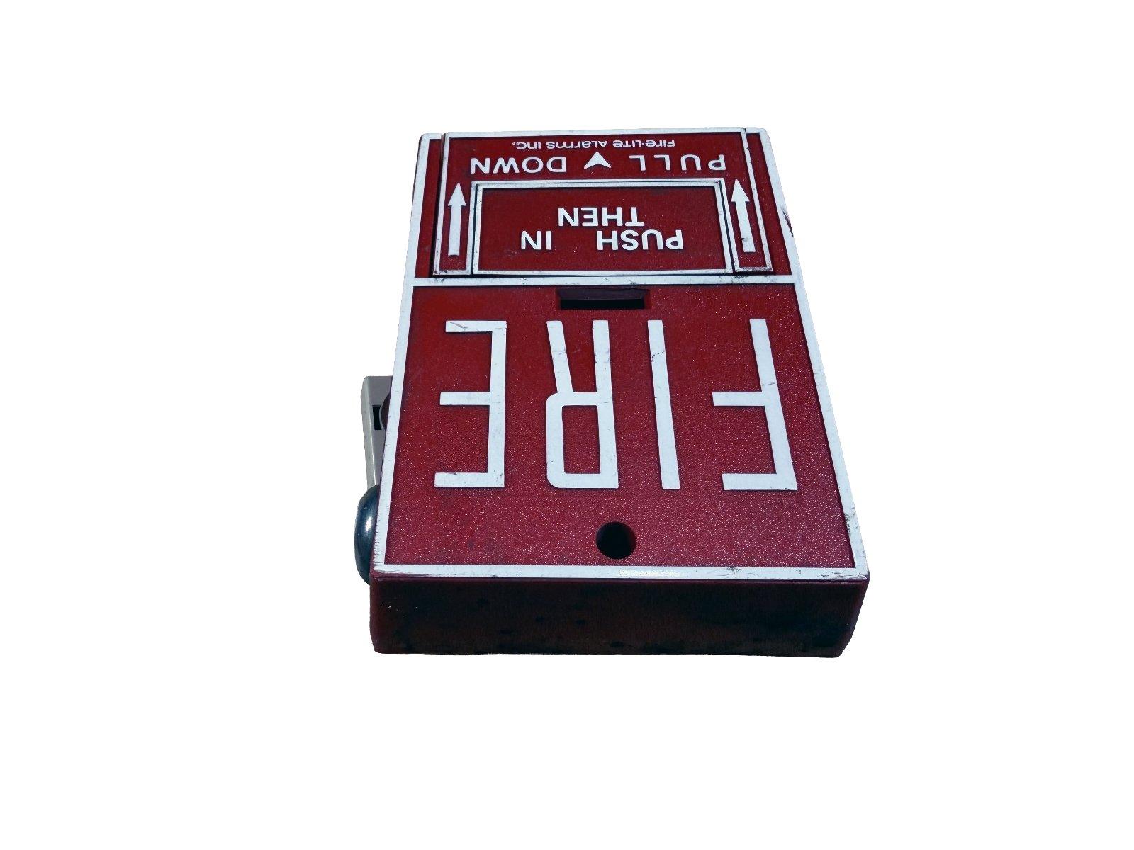 Red fire alarm pull station with 'PULL DOWN THEN PUSH IN' instructions, used fire safety equipment