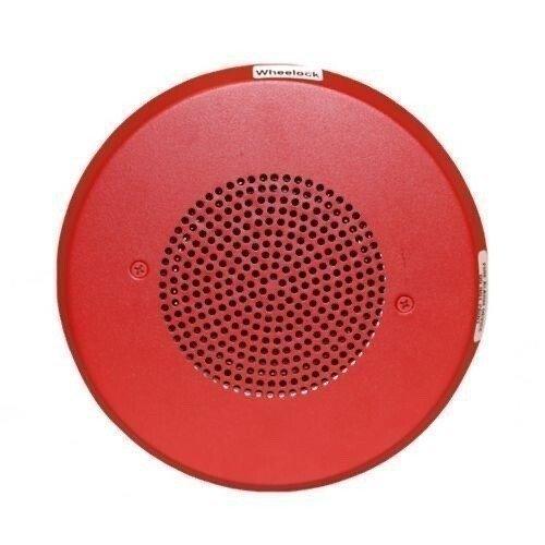 Red Wheelock fire alarm speaker with perforated grille for emergency notification systems