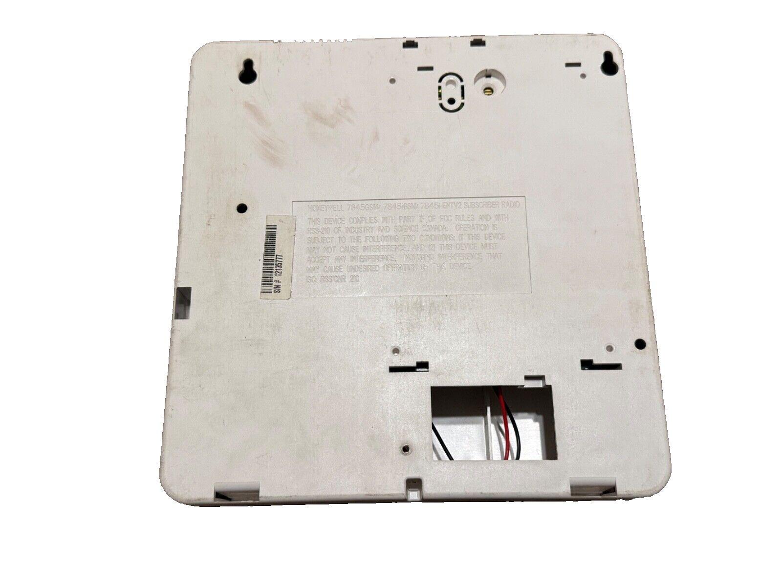 Honeywell 7845 GSM fire alarm communicator back panel with wiring terminals and mounting holes