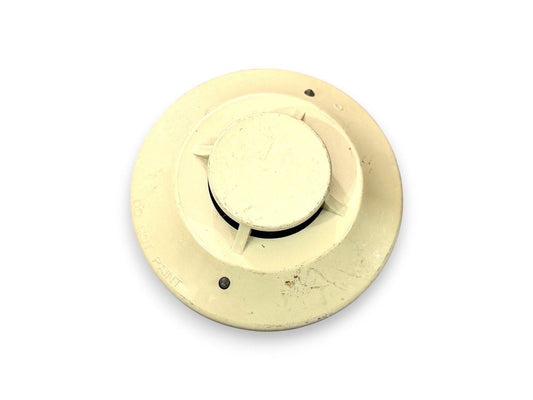 Used fire alarm smoke detector with 'DO NOT PAINT' label, off-white ceiling mount device