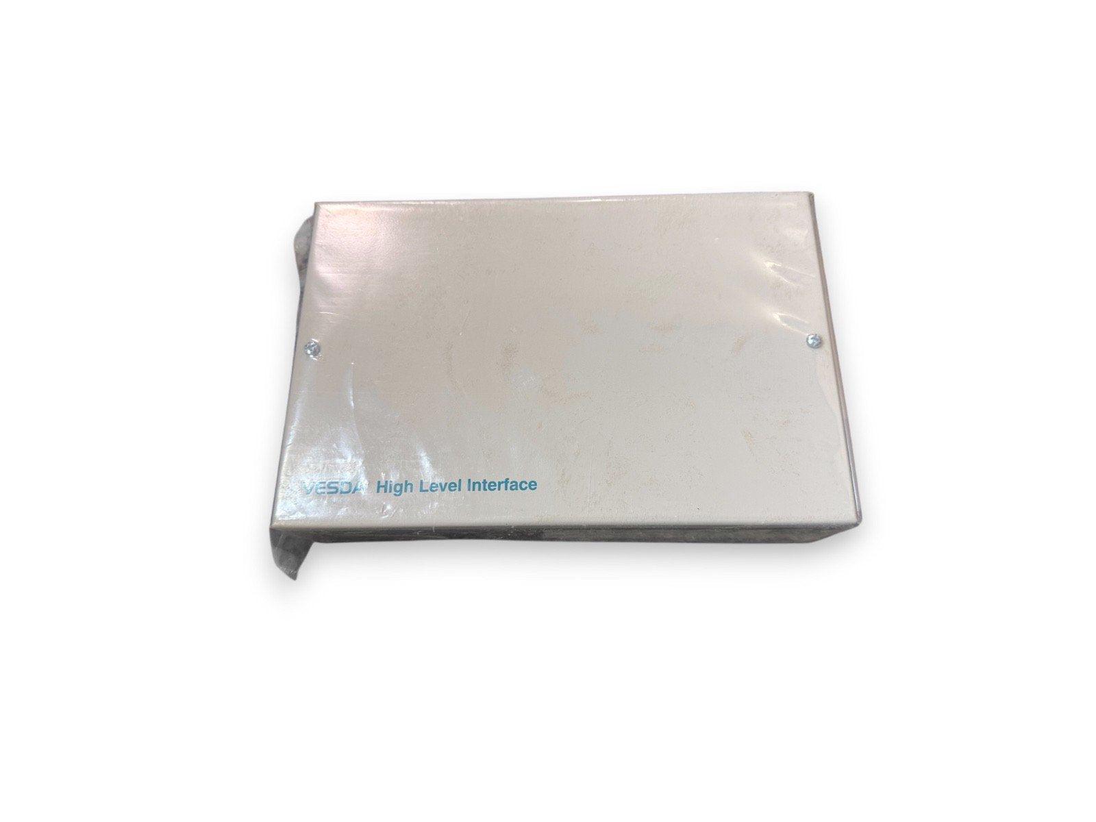 VESDA High Level Interface fire alarm component, metallic enclosure with blue text label