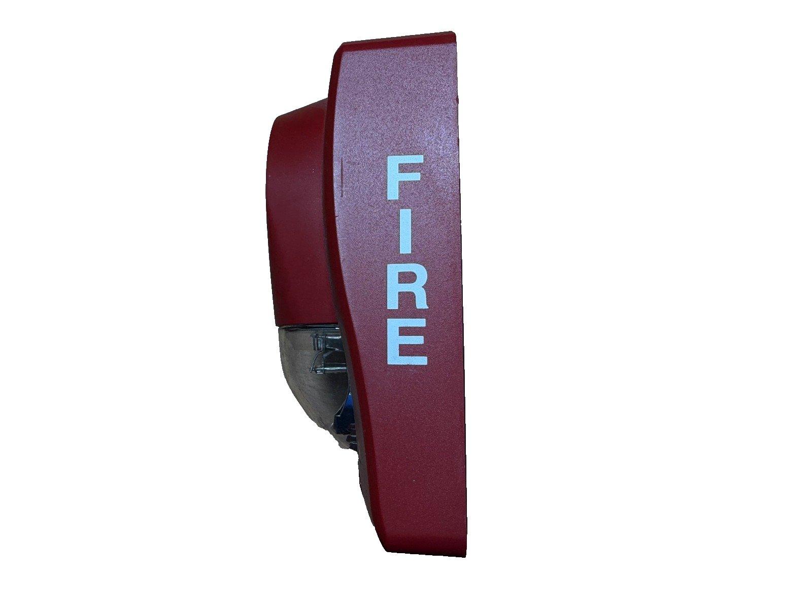 Red fire alarm horn with 'FIRE' label, used in commercial fire safety systems