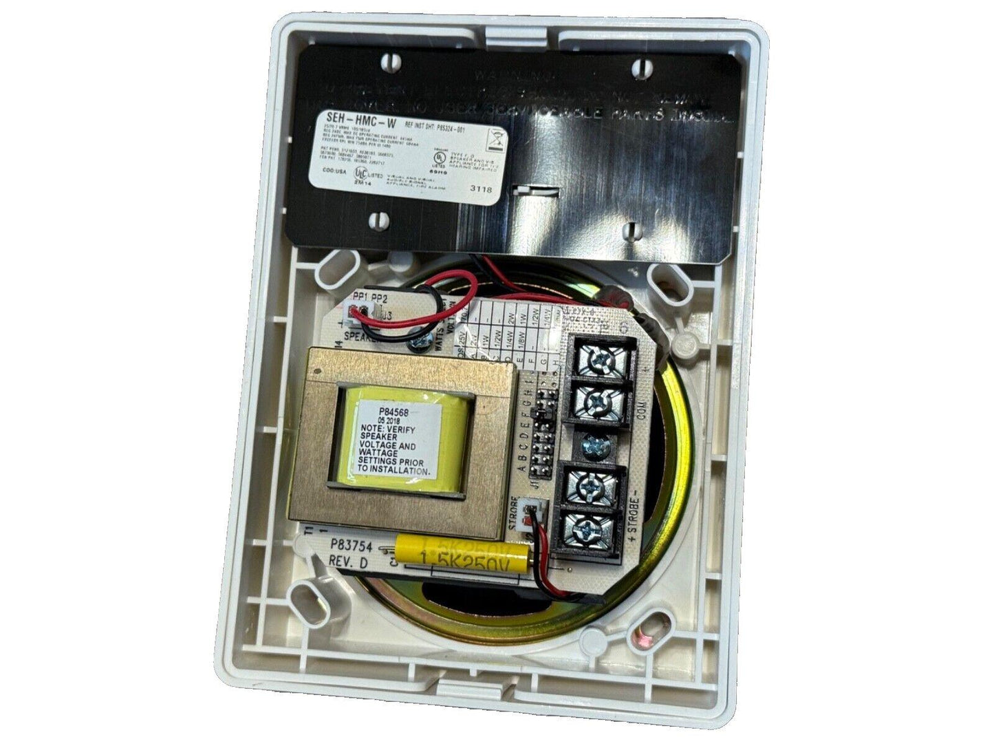 Fire alarm control panel with wiring terminals and transformer, model SEH-HMC-W, for commercial or residential use.