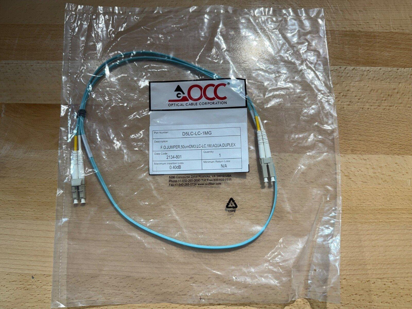 OCC D5LC-LC-1MG fiber optic jumper cable, 1m duplex, OM3 aqua, LC connectors, new in sealed bag
