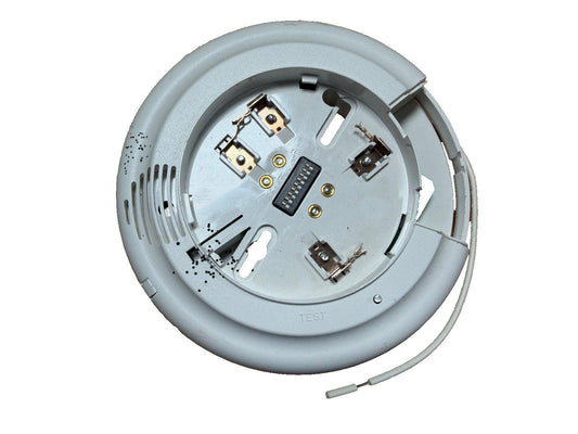 White fire alarm detector base with wiring terminals and test label, for smoke or heat detection systems