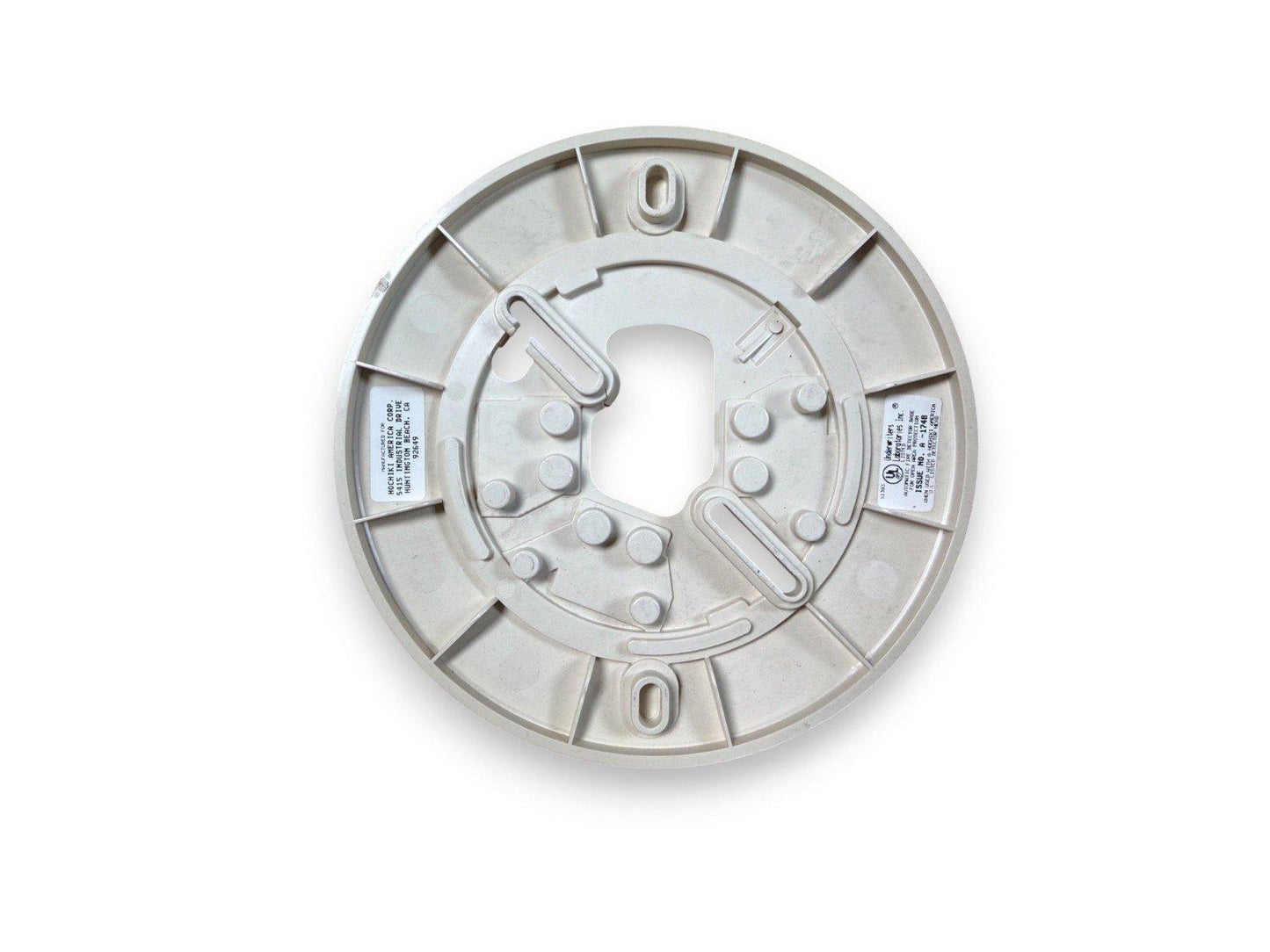 White fire alarm base with mounting clips and labels, compatible with commercial smoke detectors