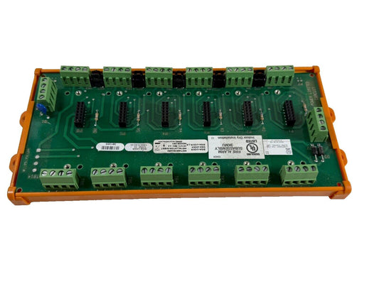 Fire alarm control panel circuit board with green terminals and UL listing for indoor use