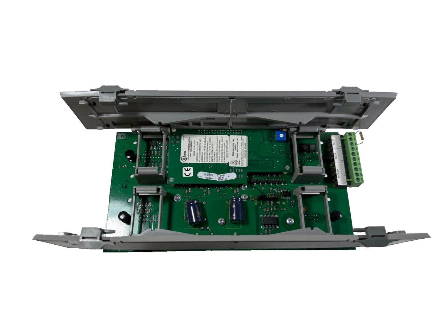 Fire alarm control panel circuit board with green PCB, connectors, and components for fire safety systems