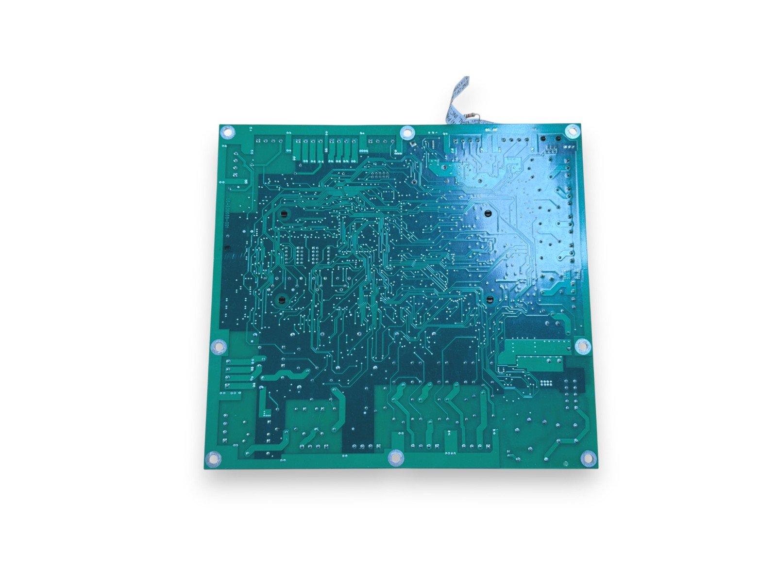 Green fire alarm control panel circuit board with mounting holes and ribbon cable connector