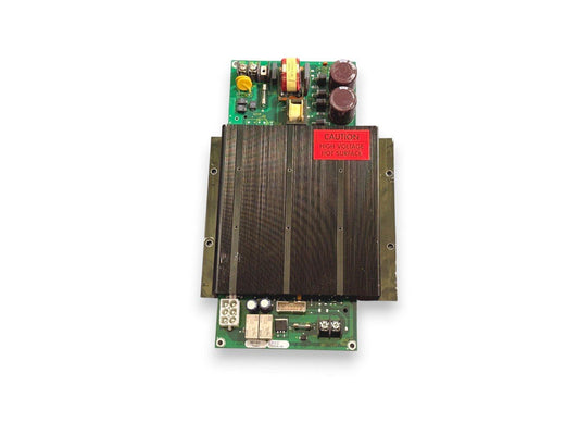 Fire alarm control panel circuit board with heat sink and high voltage warning label
